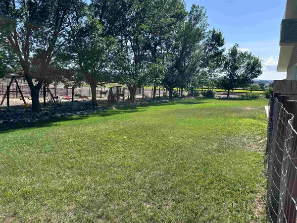 a view of a backyard of a house