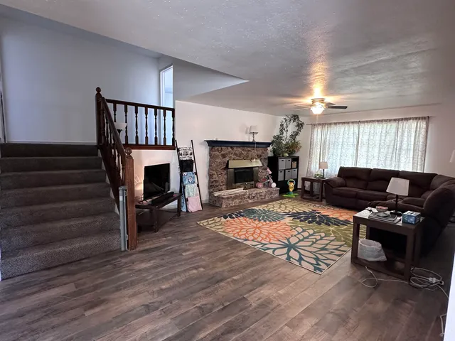 a living room with furniture and a fireplace