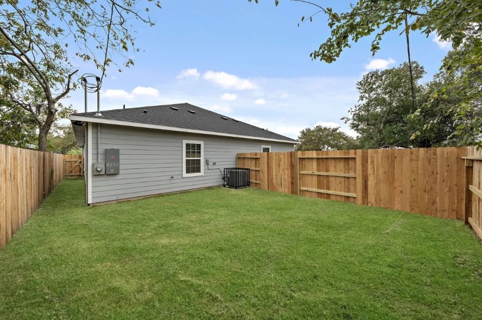 5222 Bataan Road Houston, TX 77033 - Photo 20 of 22 Fully fenced outdoor space with a clean, low-maintenance design that blends comfort and sophistication.