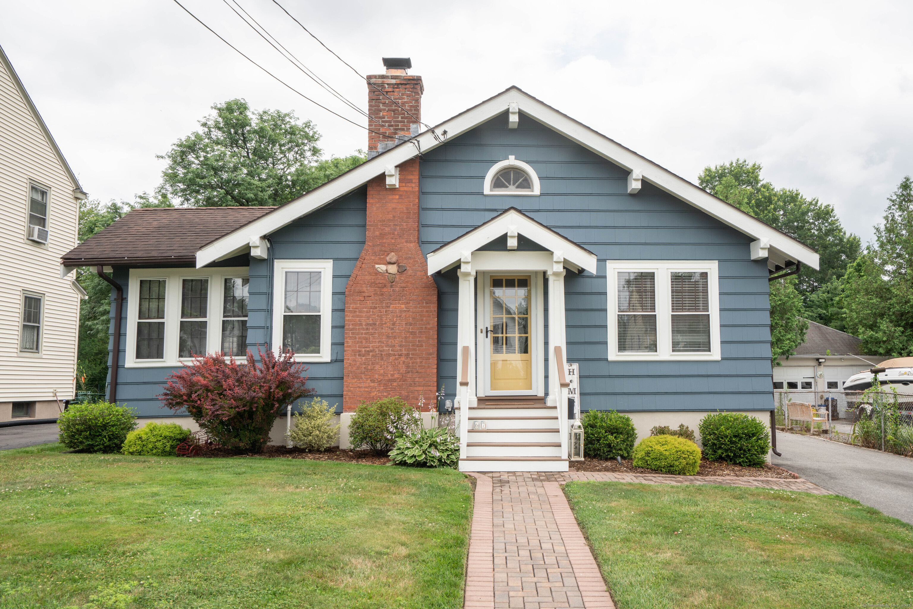 a front view of a house with garden