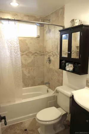 a bathroom with a toilet sink and bathtub
