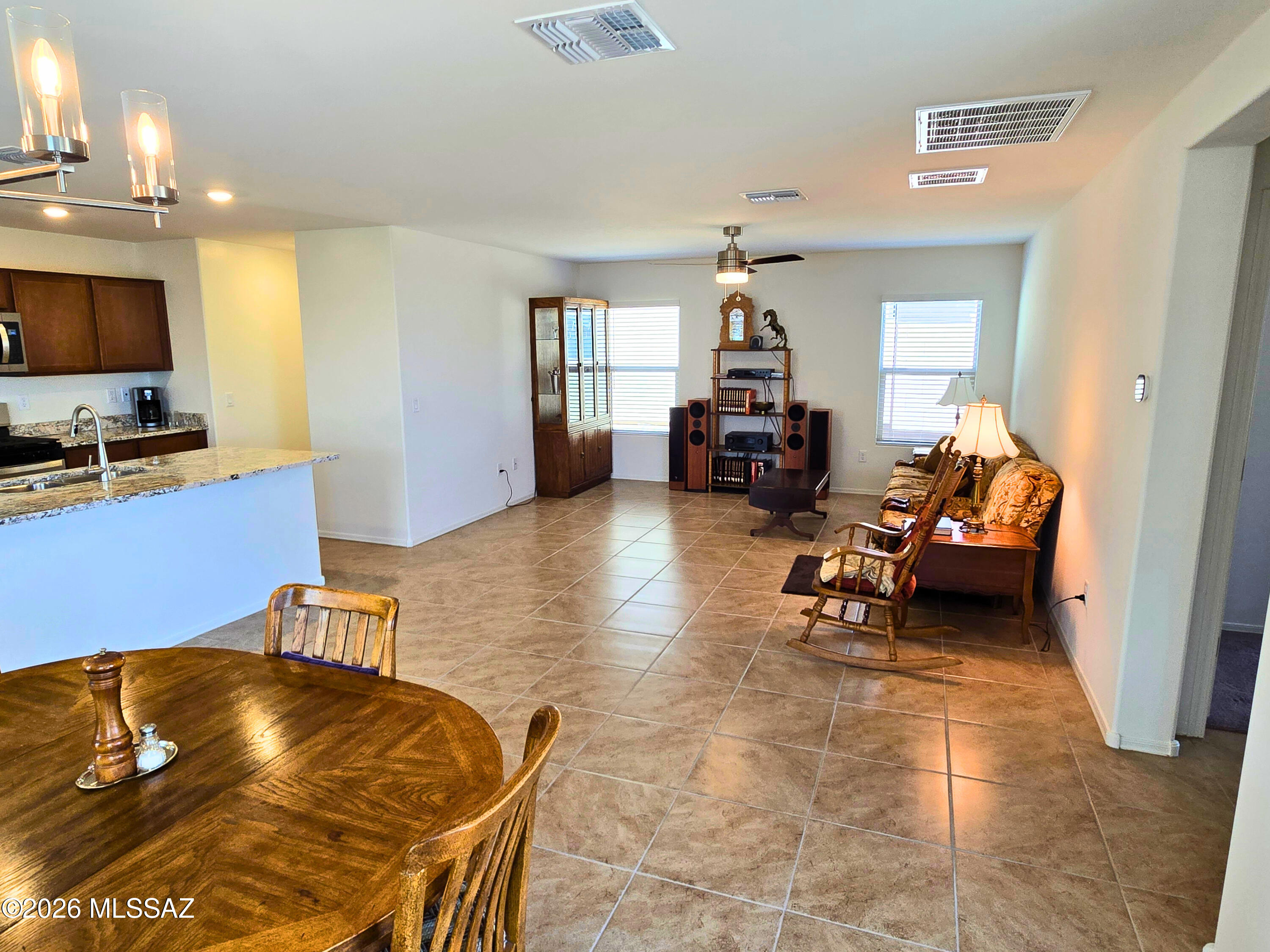 6343 South Rigby Way Tucson, AZ 85746 - Photo 11 of 29 a living room with furniture and a flat screen tv