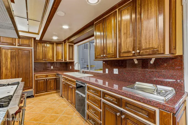a kitchen with a stove and a table