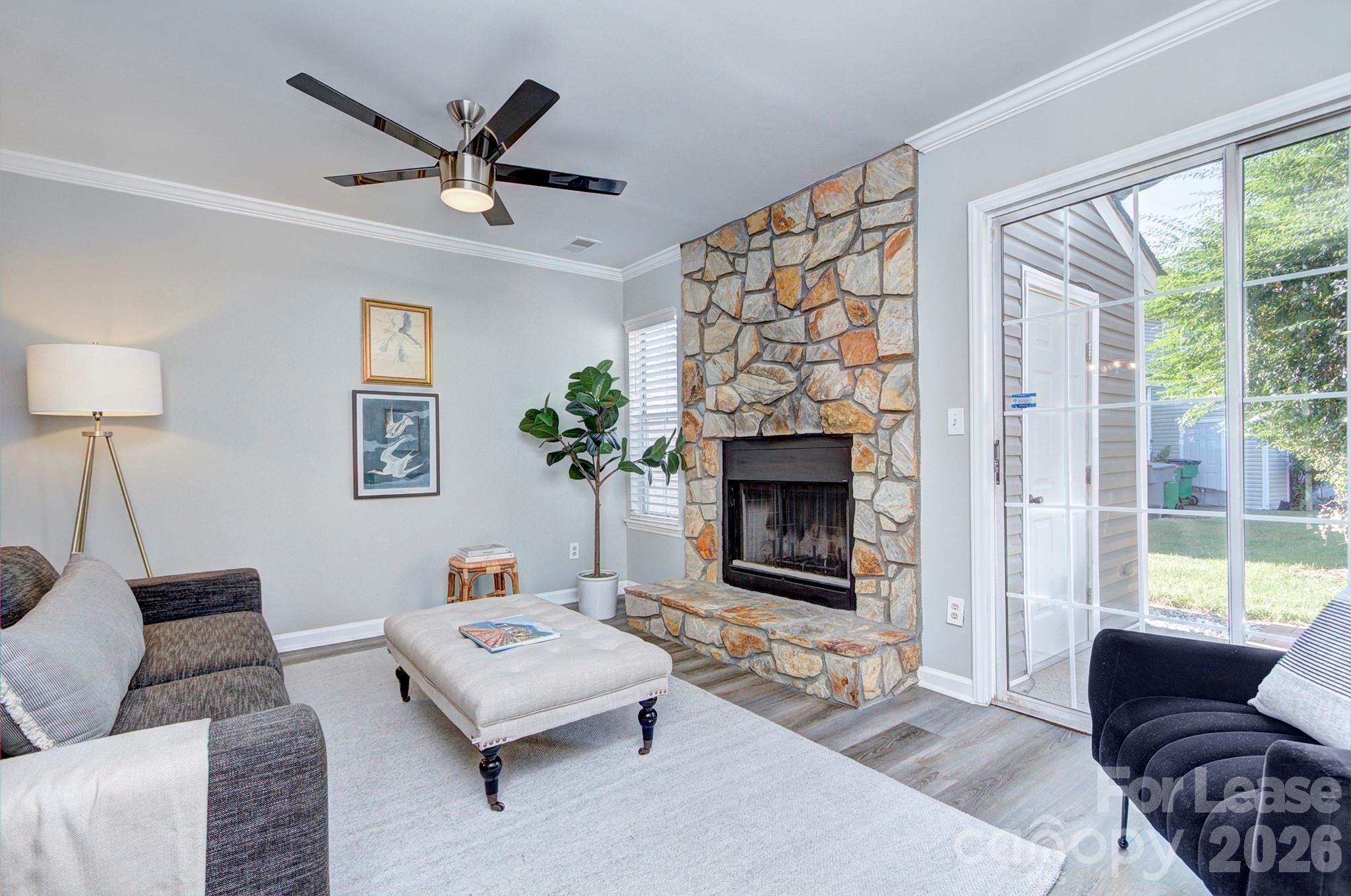 8268 Golf Ridge Drive Charlotte, NC 28277 - Photo 12 of 24 a living room with furniture and a fireplace
