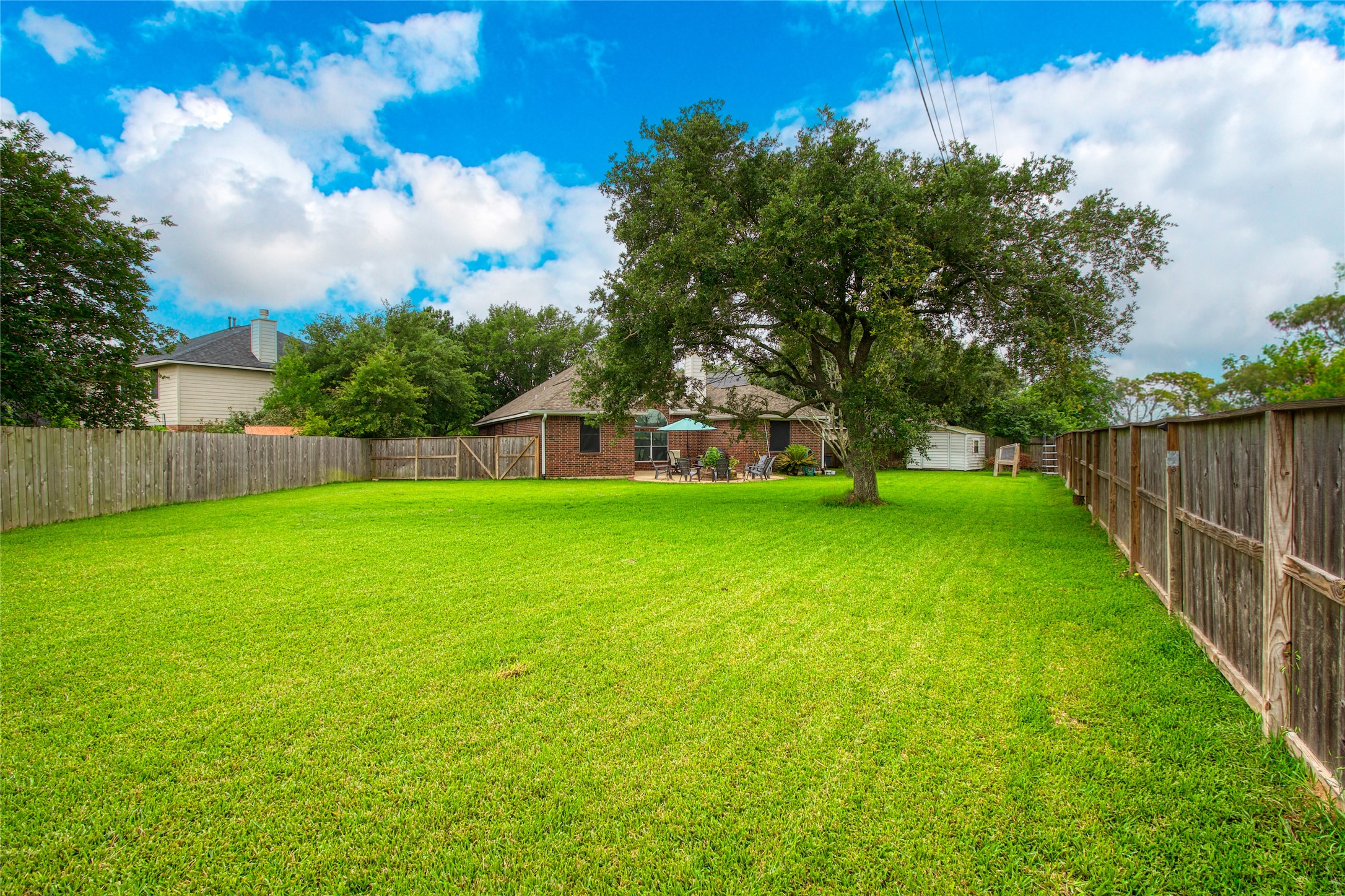 21014 Jessica Rose Lane Spring, TX 77379 - Photo 28 of 30 a view of yard with grass and trees in the background