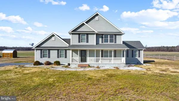 a front view of a house with swimming pool and porch