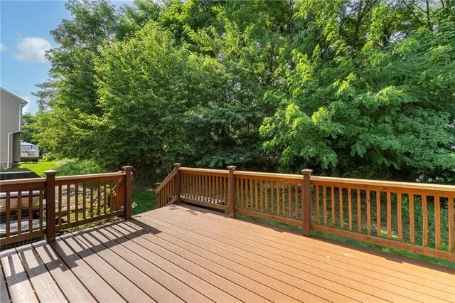 a view of deck with wooden floor and fence