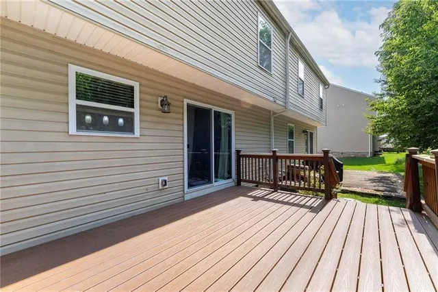 a view of a wooden deck with a patio
