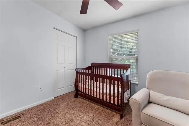 a bedroom with furniture and a window
