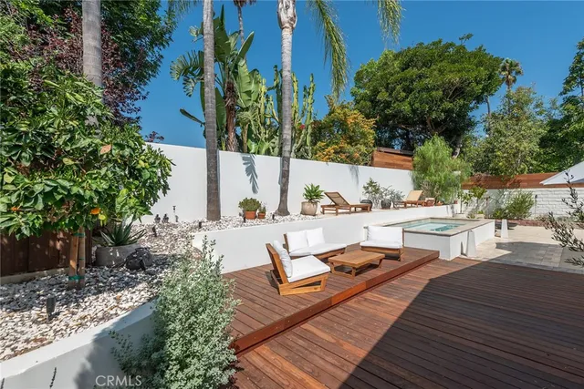 a view of balcony with wooden floor and outdoor seating