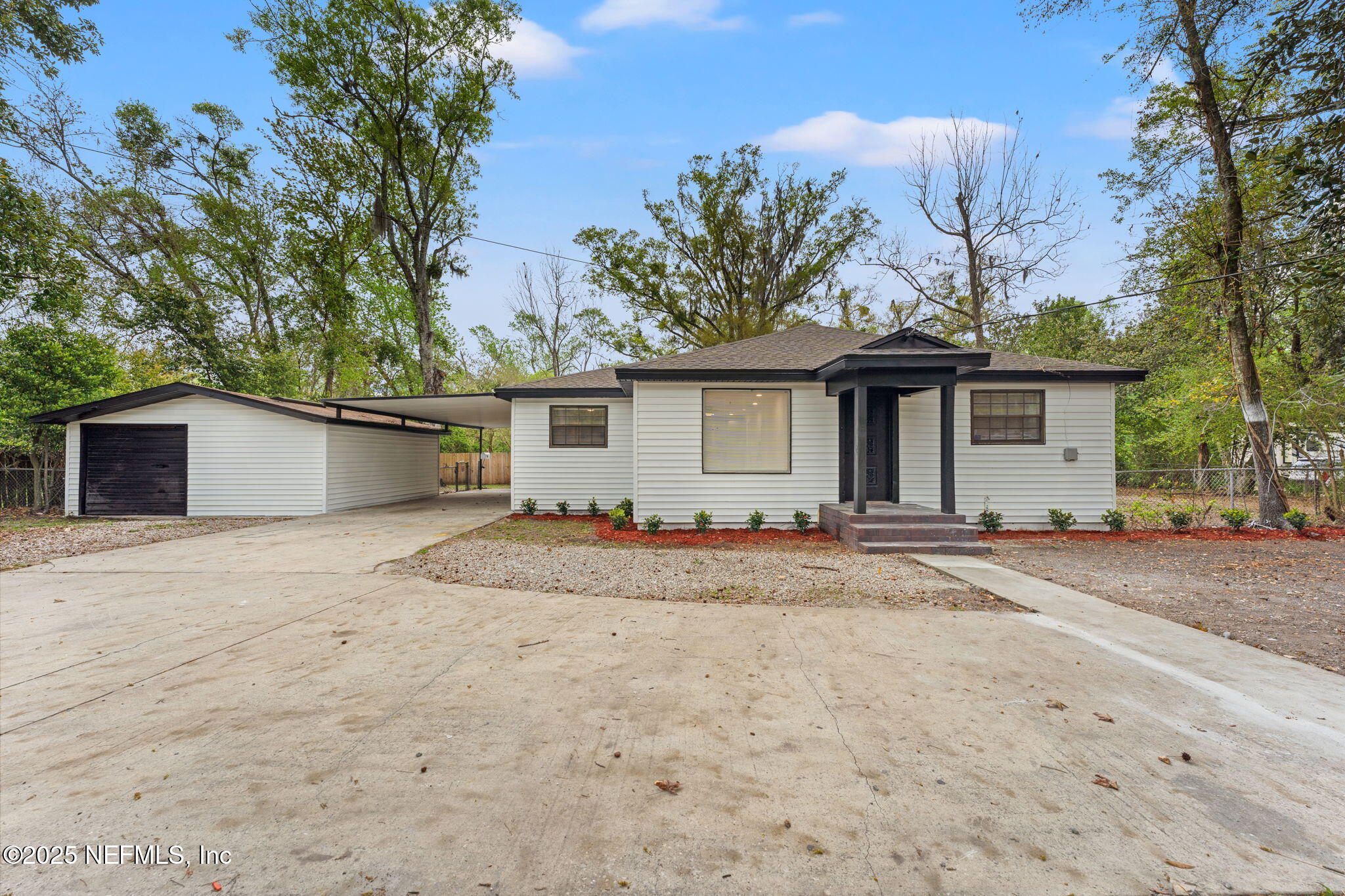 6211 Firestone Road Jacksonville, FL 32244 - Photo 1 of 41 a view of a house with a patio