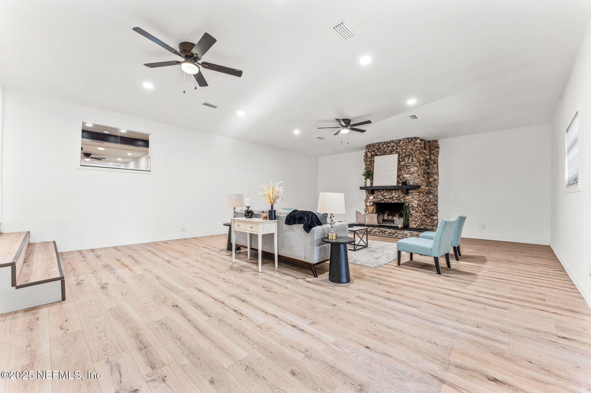 6211 Firestone Road Jacksonville, FL 32244 - Photo 12 of 41 a living room with furniture and a wooden floor