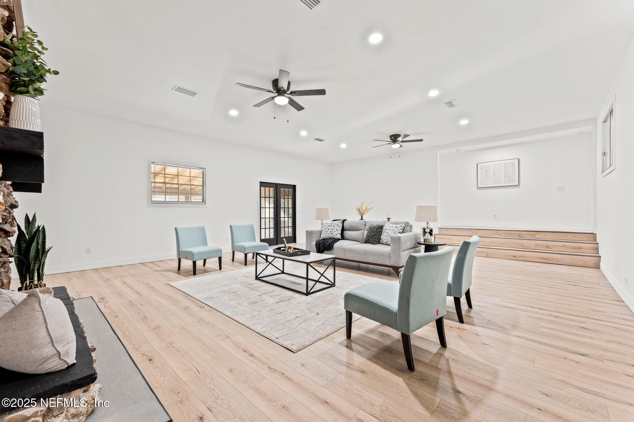 6211 Firestone Road Jacksonville, FL 32244 - Photo 13 of 41 a living room with furniture and a wooden floor