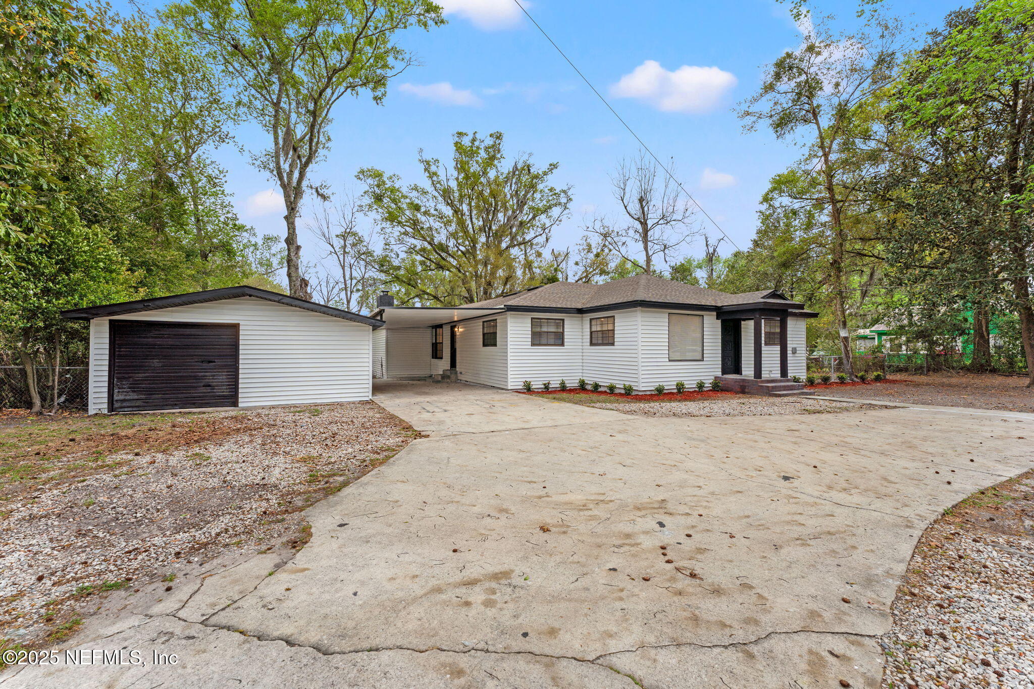 6211 Firestone Road Jacksonville, FL 32244 - Photo 3 of 41 a view of a house with a yard
