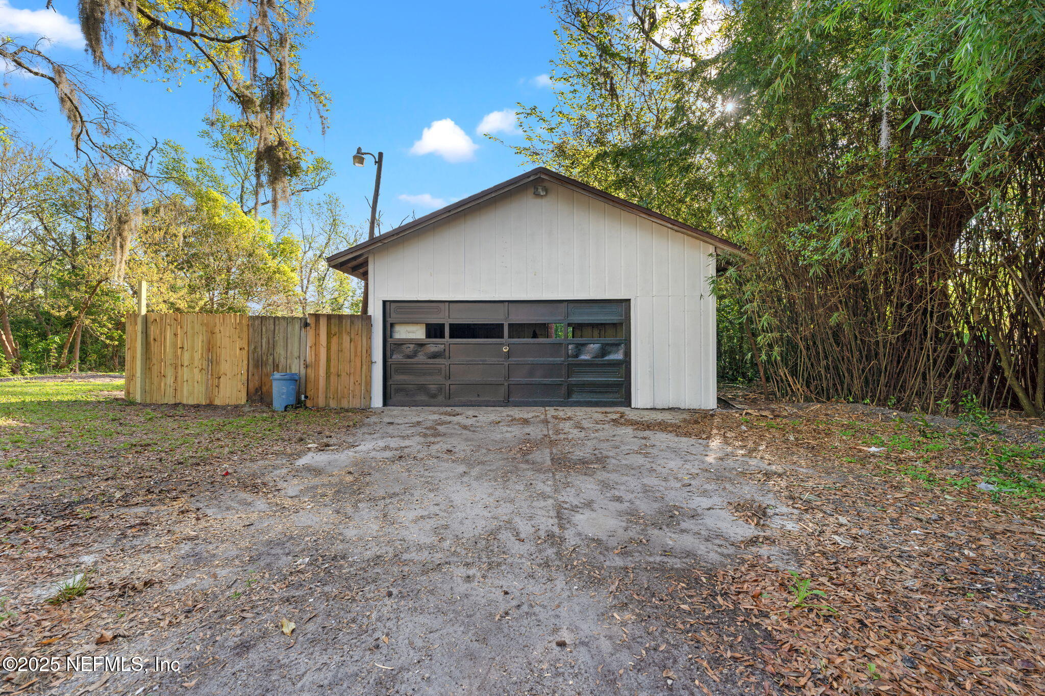 6211 Firestone Road Jacksonville, FL 32244 - Photo 31 of 41 a view of a house with a yard and garage