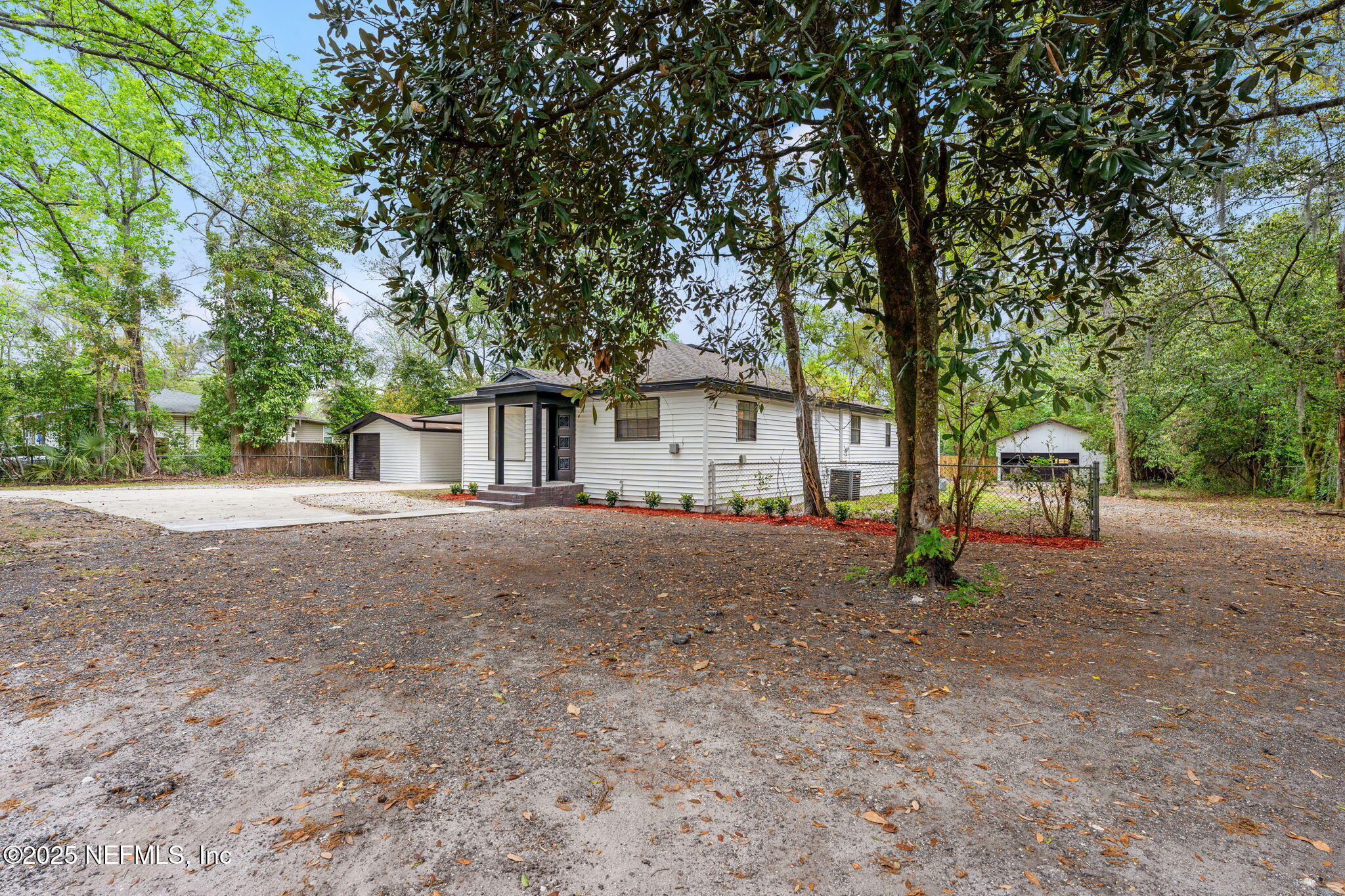 6211 Firestone Road Jacksonville, FL 32244 - Photo 32 of 41 a view of a house with a tree in the background