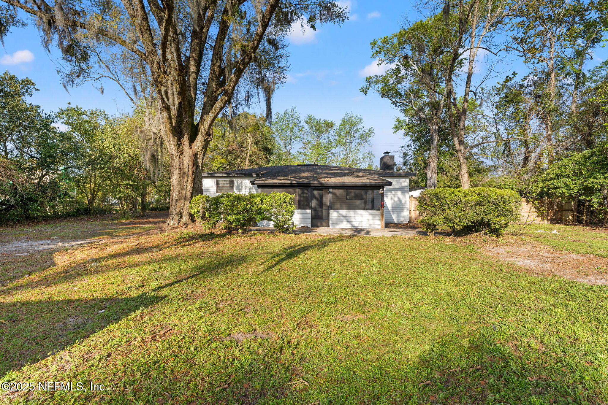 6211 Firestone Road Jacksonville, FL 32244 - Photo 33 of 41 a view of a house with pool and a yard