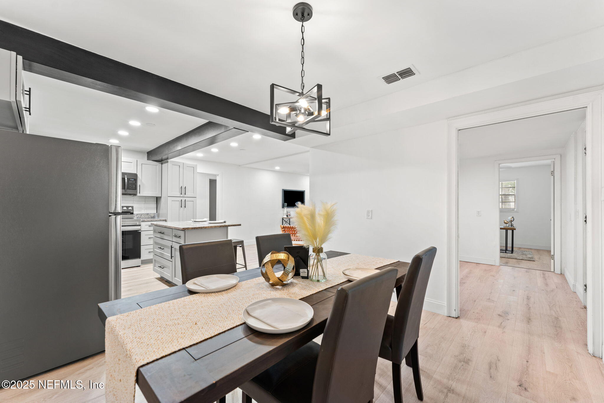 6211 Firestone Road Jacksonville, FL 32244 - Photo 10 of 41 a view of a dining room with furniture and wooden floor