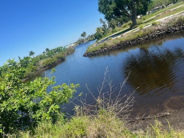 8602 Riverside Drive Punta Gorda, FL 33982 - Photo 13 of 13 a view of a lake with a yard