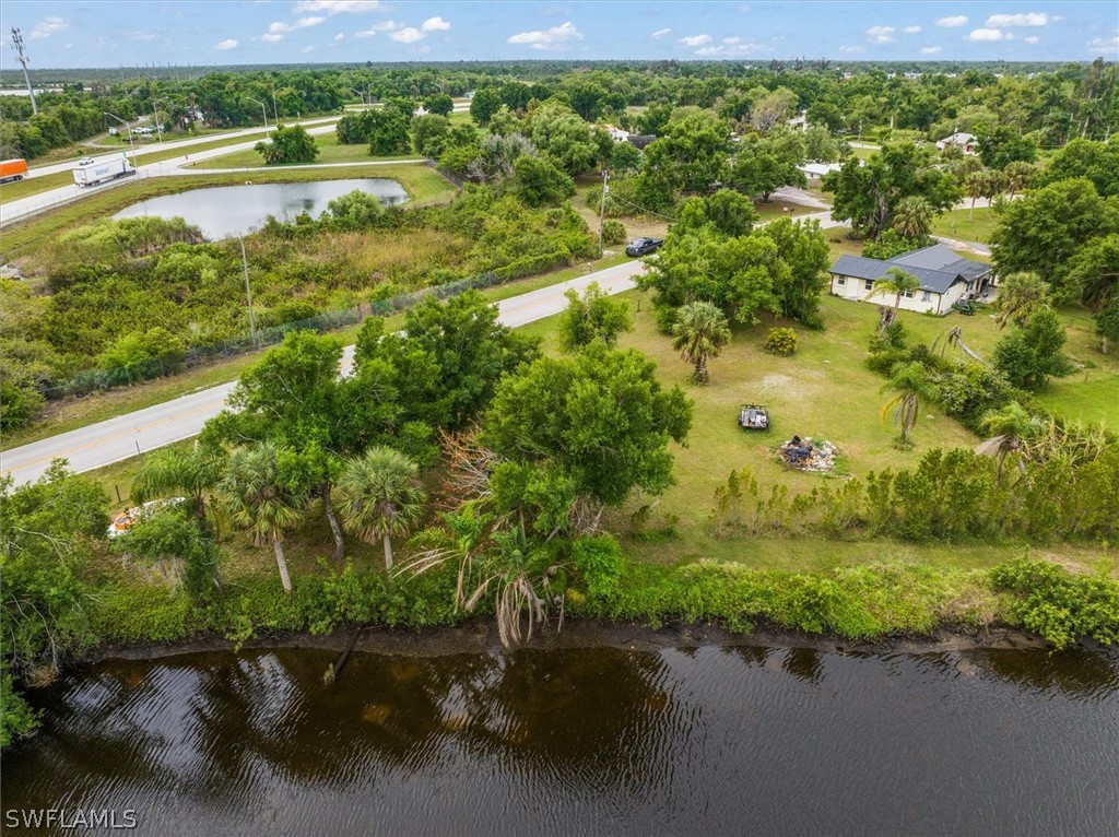 8602 Riverside Drive Punta Gorda, FL 33982 - Photo 2 of 13 a view of a lake view with a yard
