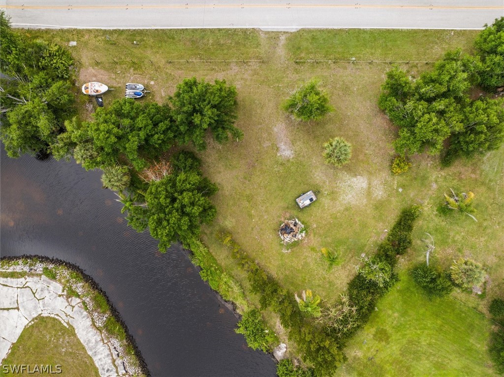 8602 Riverside Drive Punta Gorda, FL 33982 - Photo 3 of 13 a view of a lake from a yard