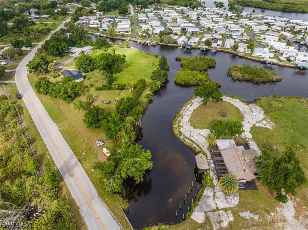 8602 Riverside Drive Punta Gorda, FL 33982 - Photo 7 of 13 an aerial view of a house with a yard and lake view