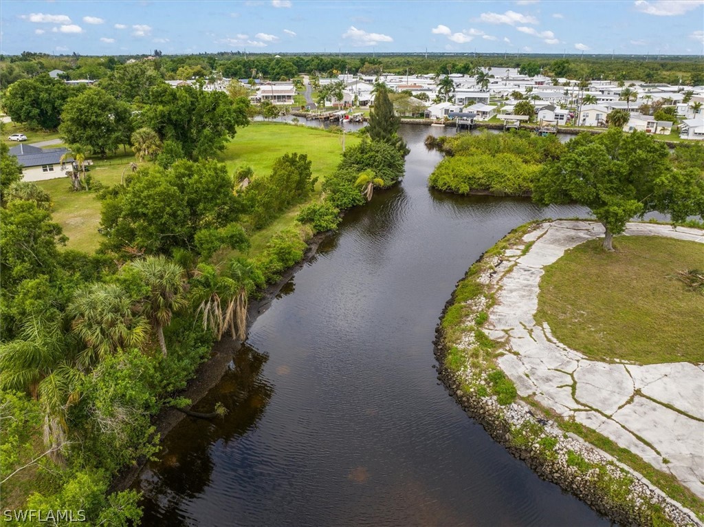8602 Riverside Drive Punta Gorda, FL 33982 - Photo 8 of 13 a view of a swimming pool with a lake