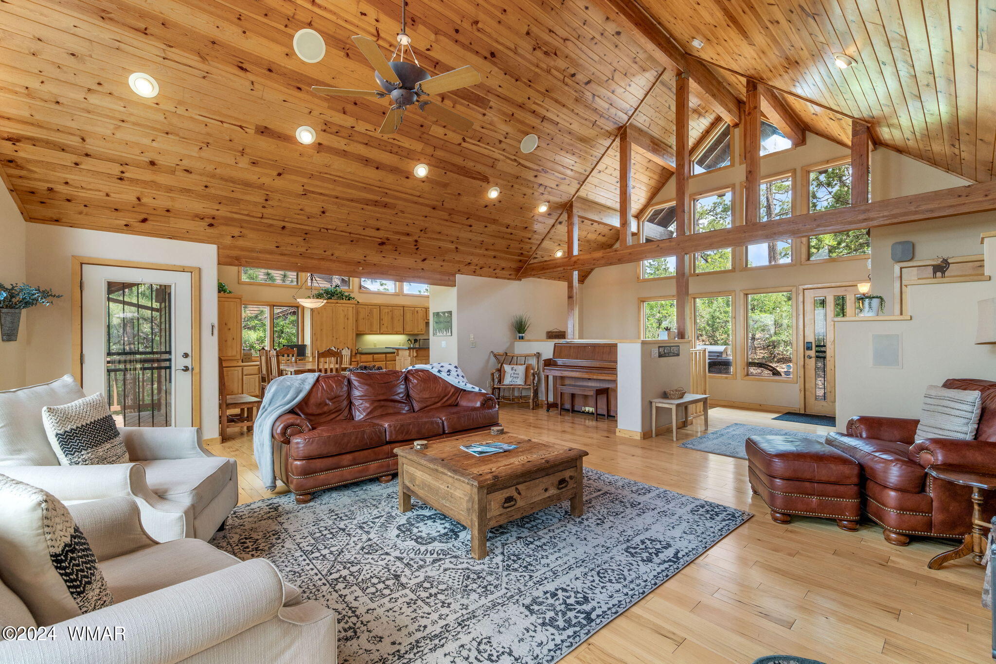 3361 West Falling Leaf Road Show Low, AZ 85901 - Photo 2 of 49 Tongue-and-groove vaulted ceilings enhance the space, complemented by inviting picturesque windows that offer breathtaking views of Show Low