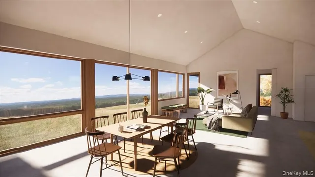 a living room with lots of furniture and large windows