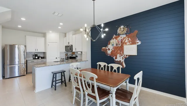a dining room with furniture and window