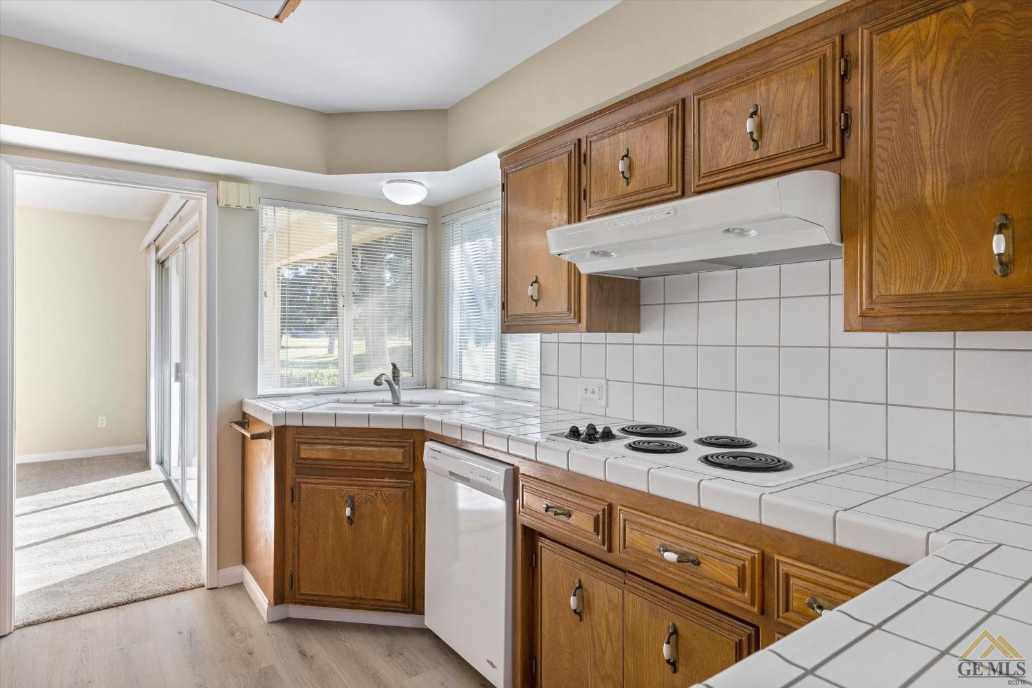 Undisclosed Address Bakersfield, CA 93309 - Photo 17 of 32 a kitchen with stainless steel appliances granite countertop a sink and cabinets