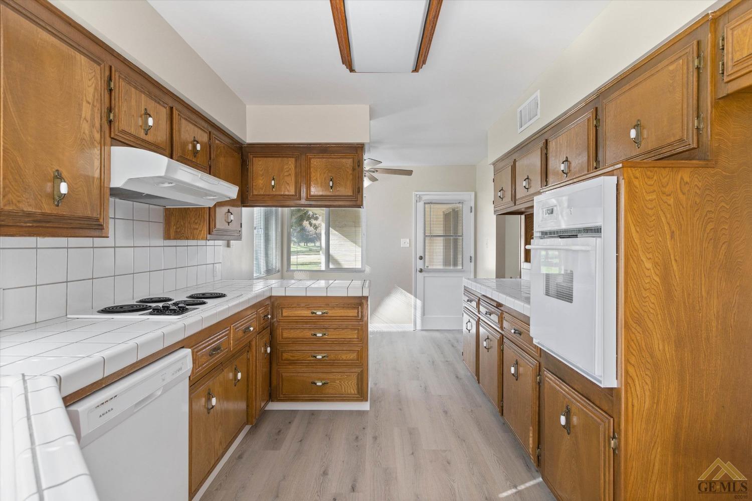 Undisclosed Address Bakersfield, CA 93309 - Photo 18 of 32 a kitchen with stainless steel appliances a stove a sink and a refrigerator