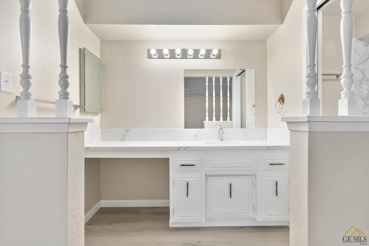 Undisclosed Address Bakersfield, CA 93309 - Photo 23 of 32 a bathroom with a sink and a mirror