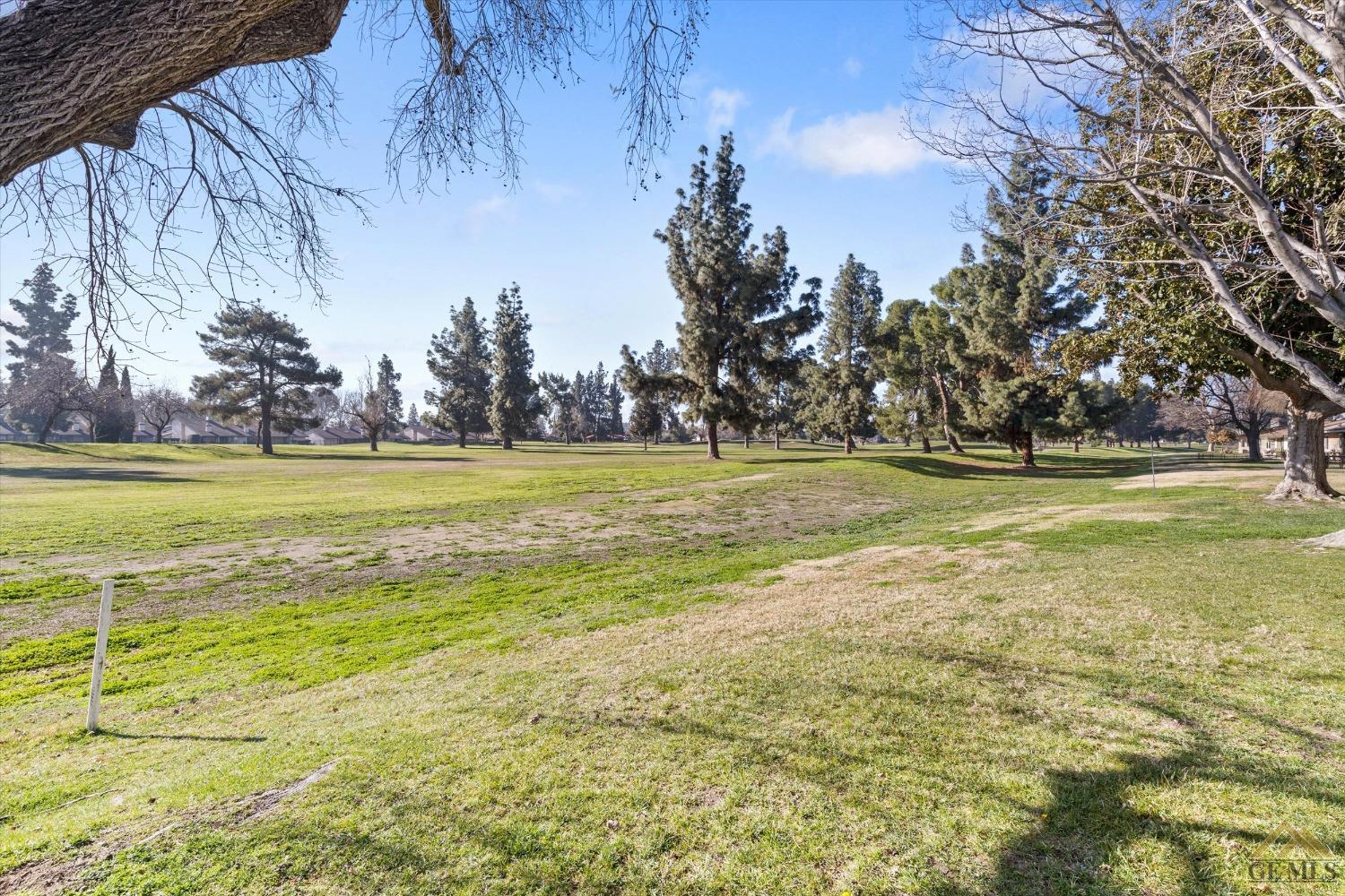 Undisclosed Address Bakersfield, CA 93309 - Photo 29 of 32 a view of a swimming pool with an outdoor space and seating area