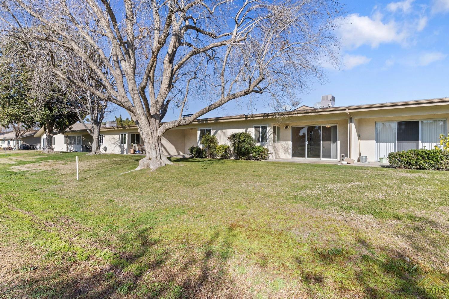 Undisclosed Address Bakersfield, CA 93309 - Photo 31 of 32 a front view of house with yard and green space