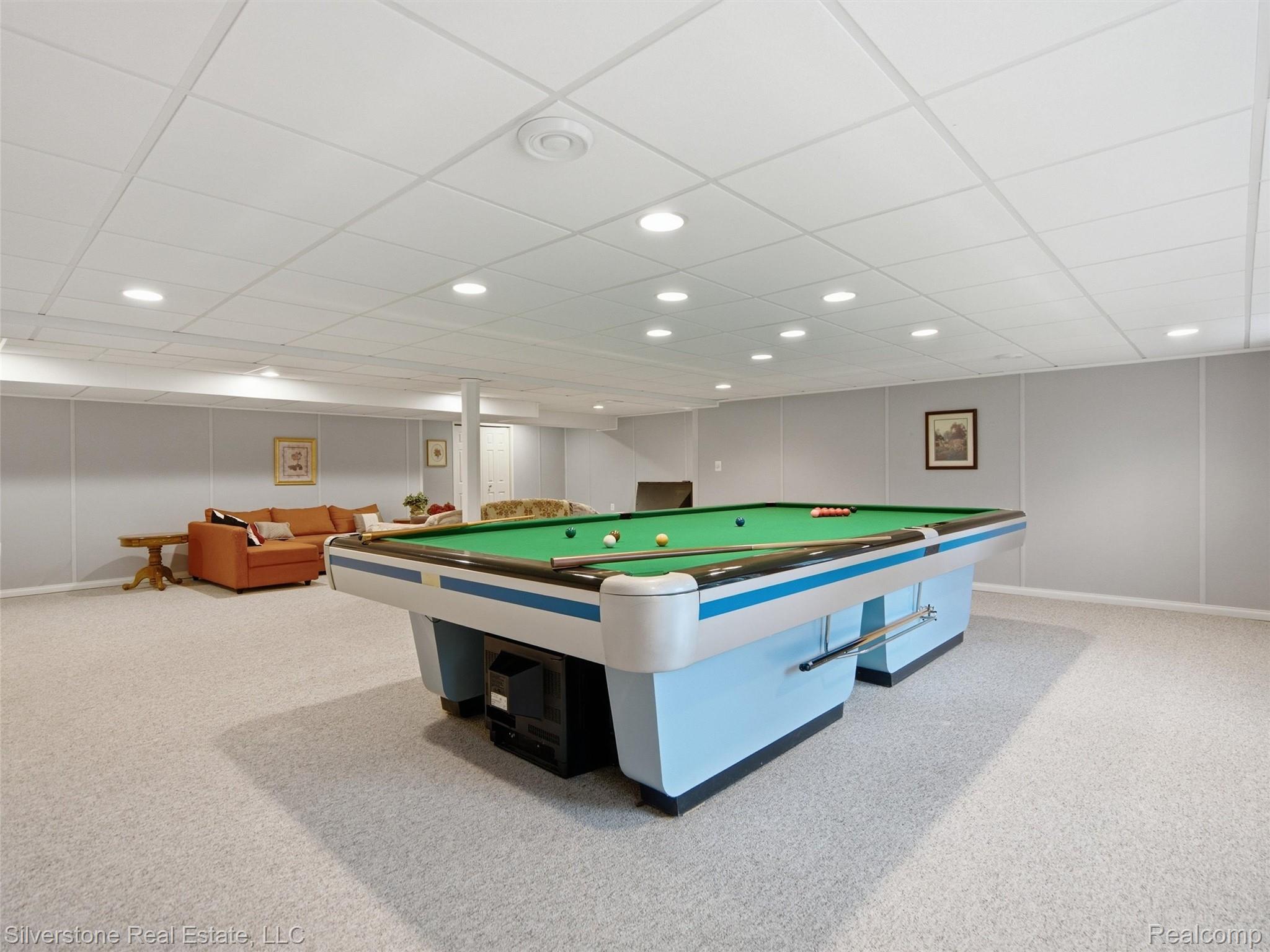 6577 Edith Court Troy, MI 48085 - Photo 47 of 61 Recreation room featuring recessed lighting, a drop ceiling, light-toned carpet, and paneling on the walls
