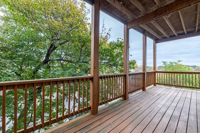 a view of porch with wooden floor