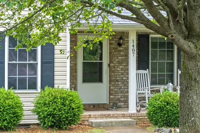 a house view with a garden space