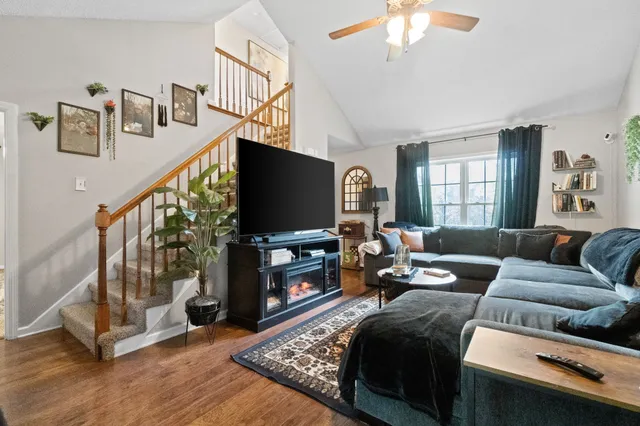 a living room with furniture and a flat screen tv