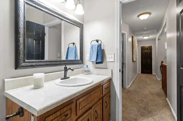 a en suite bathroom with a sink and a mirror