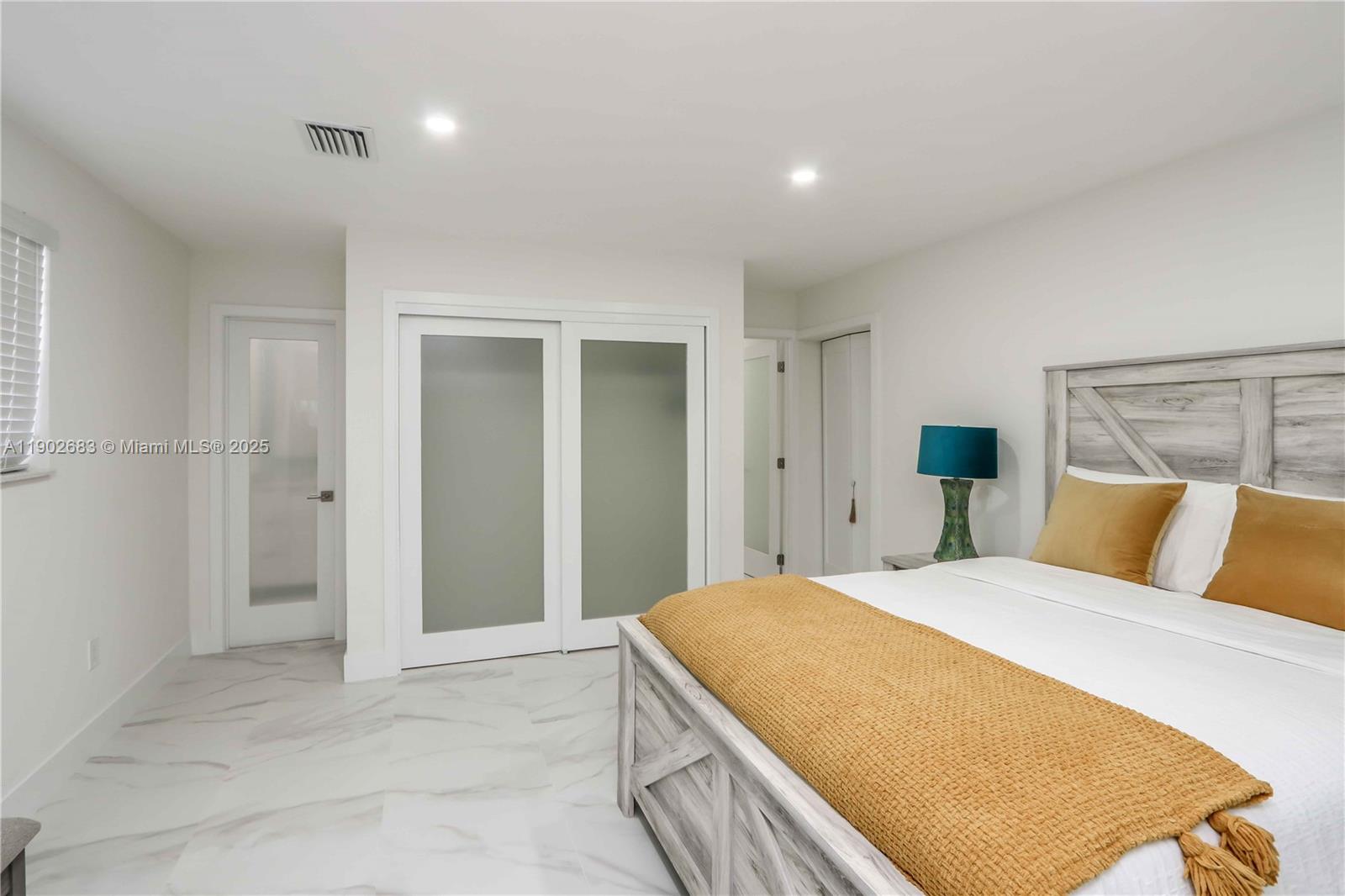 1030 Southwest 10th Avenue Miami, FL 33130 - Photo 15 of 30 a spacious bedroom with a bed and a cabinets