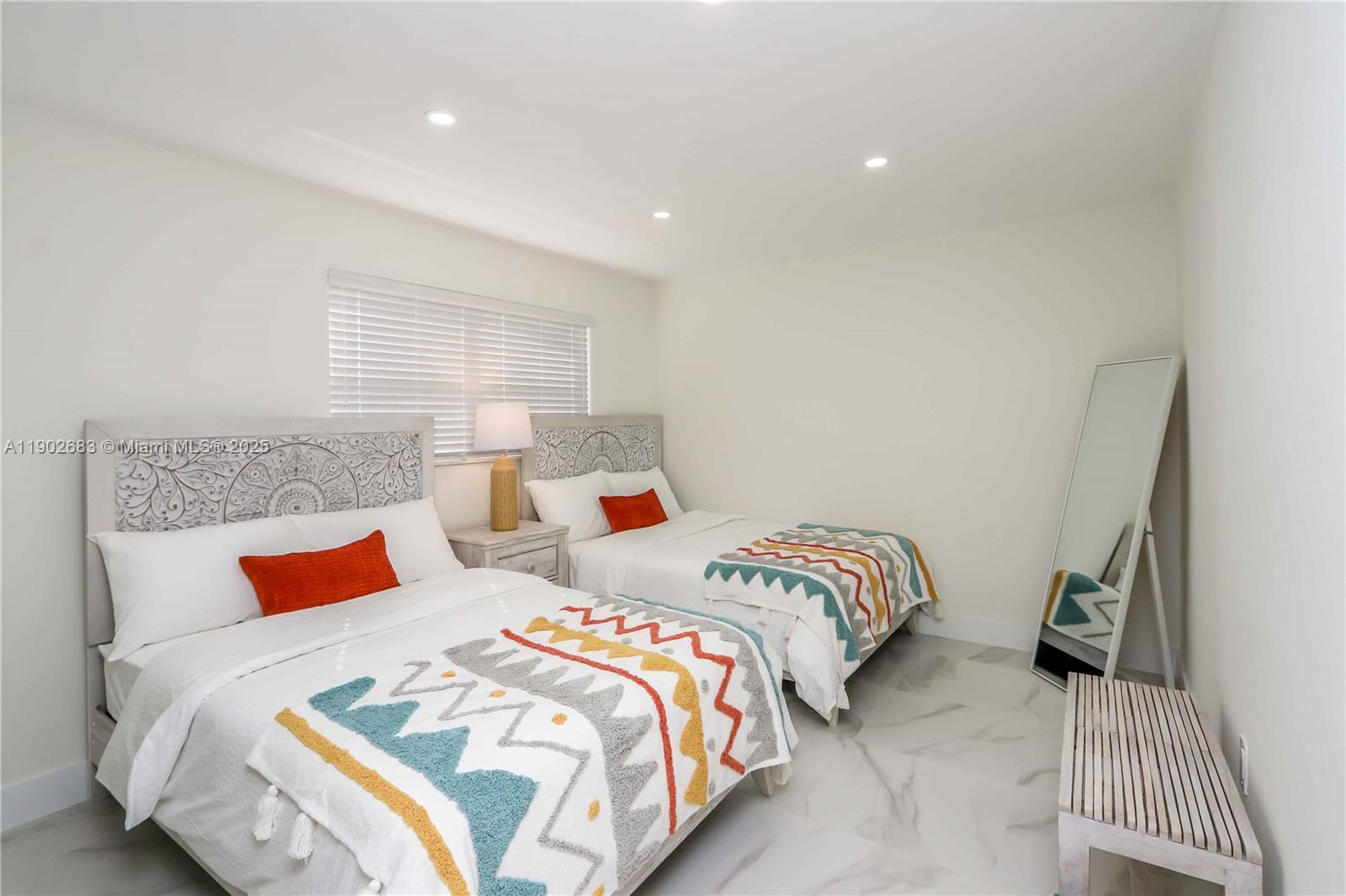 1030 Southwest 10th Avenue Miami, FL 33130 - Photo 18 of 30 a bedroom with two beds and a lamp