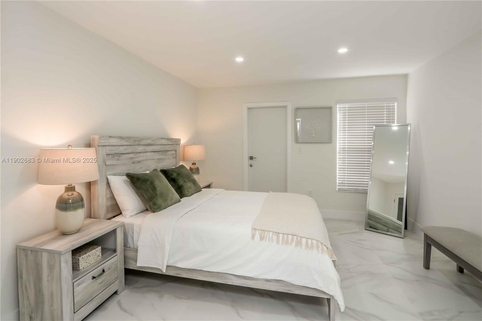 1030 Southwest 10th Avenue Miami, FL 33130 - Photo 19 of 30 a bedroom with a bed and a view of bathroom