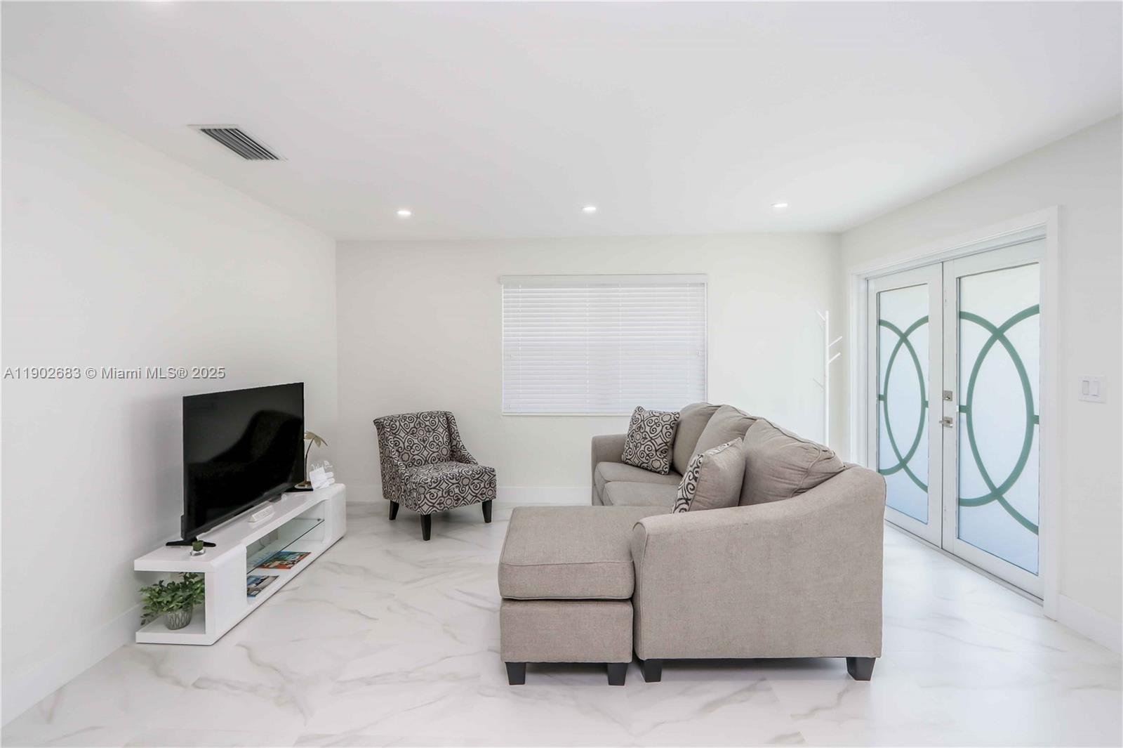 1030 Southwest 10th Avenue Miami, FL 33130 - Photo 27 of 30 a living room with furniture and a flat screen tv