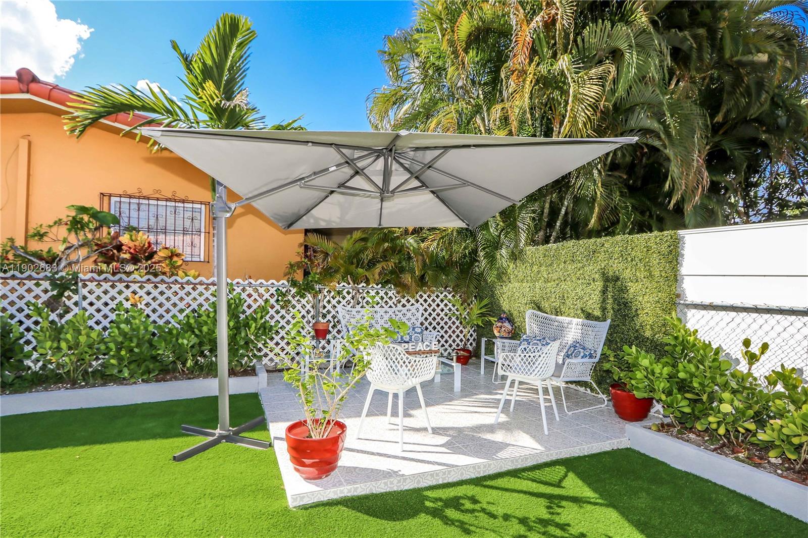 1030 Southwest 10th Avenue Miami, FL 33130 - Photo 28 of 30 a patio with a yard table and chairs
