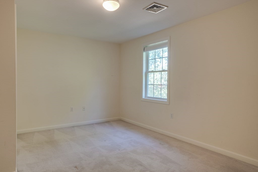 985 Trapelo Road, Unit 22 Waltham, MA 02452 - Photo 15 of 29 an empty room with a window