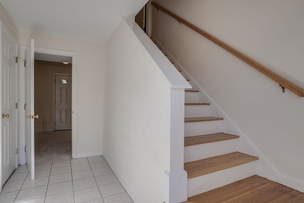 985 Trapelo Road, Unit 22 Waltham, MA 02452 - Photo 17 of 29 a view of entryway and hall with wooden floor