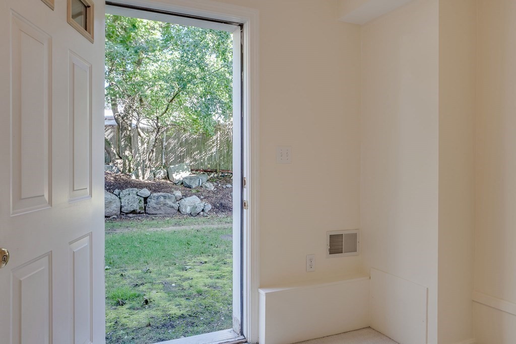 985 Trapelo Road, Unit 22 Waltham, MA 02452 - Photo 21 of 29 a yellow room with a garden view