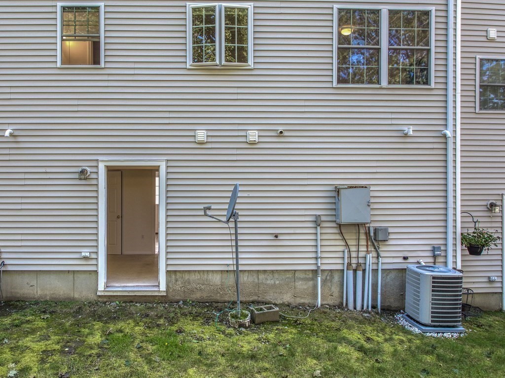 985 Trapelo Road, Unit 22 Waltham, MA 02452 - Photo 22 of 29 a view of a house and next to a yard
