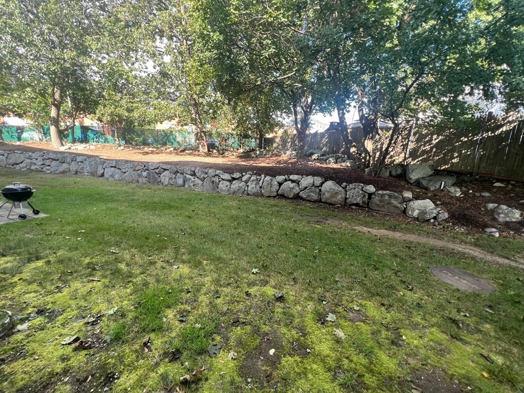 985 Trapelo Road, Unit 22 Waltham, MA 02452 - Photo 24 of 29 a view of a field with large trees